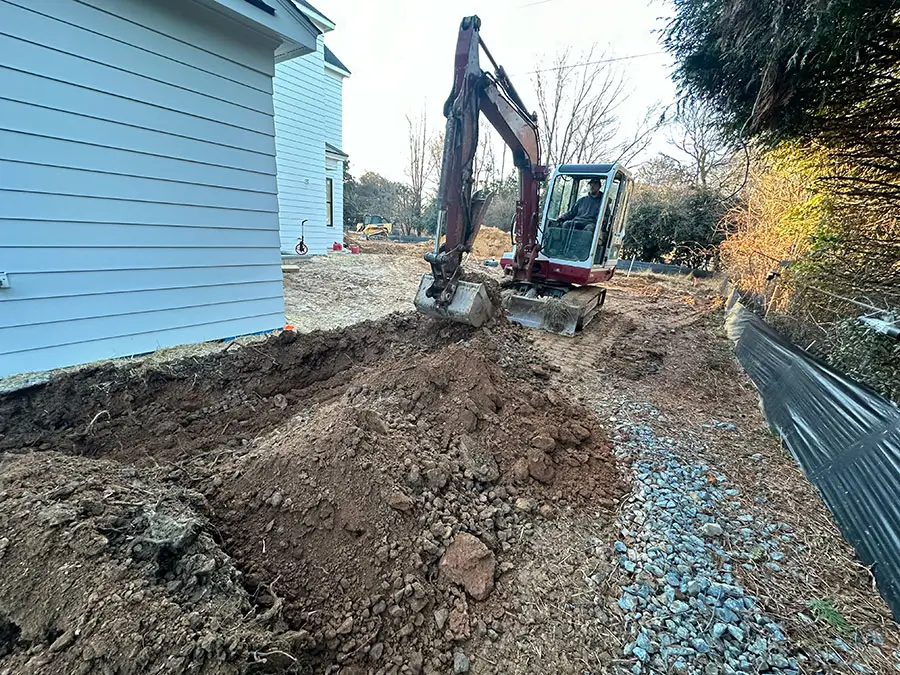 Excavator digging a trench for water line repair service